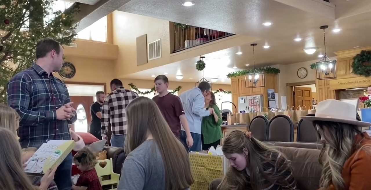 The duo kissed under the mistletoe at their family's large Christmas party