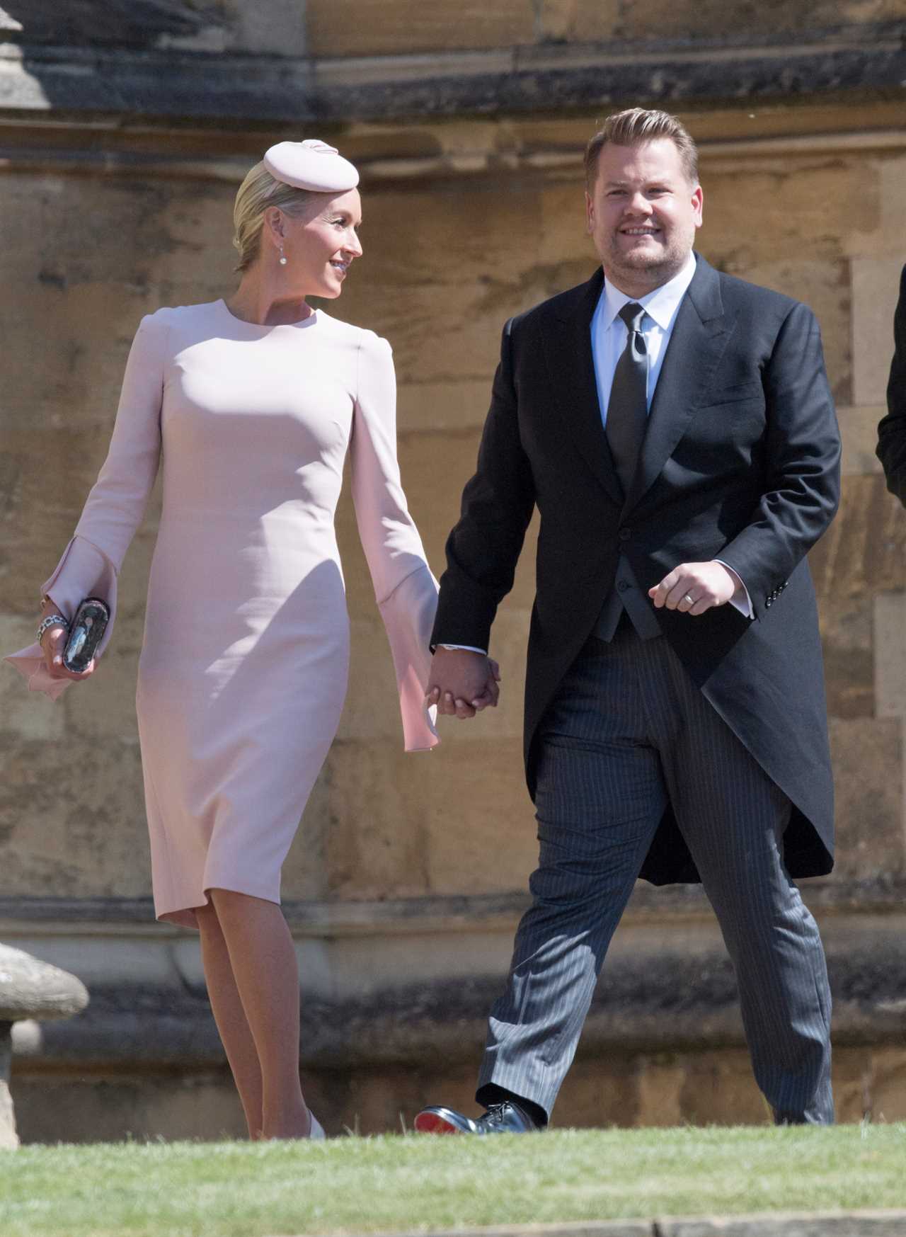 James Corden and his wife Julia pictured arriving at the wedding in the morning