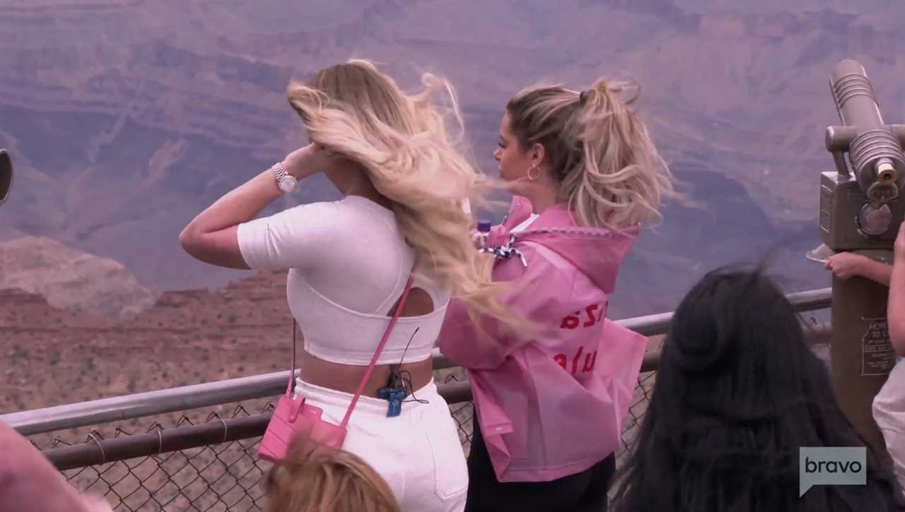 As they took in the view, Kim's wig almost blew off