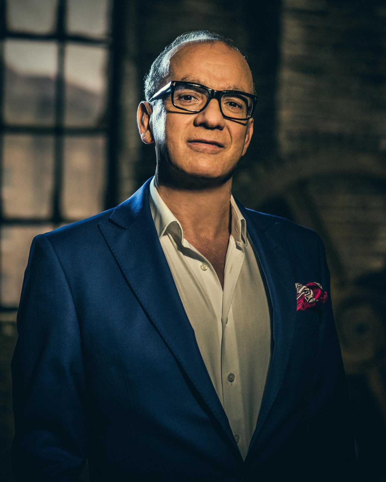 Touker Suleyman posing on the set of Dragons' Den