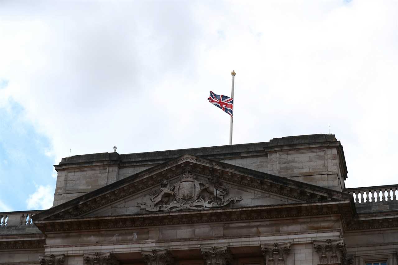 The Union Jack flag flies at half-mast on top of Buckingham Palace