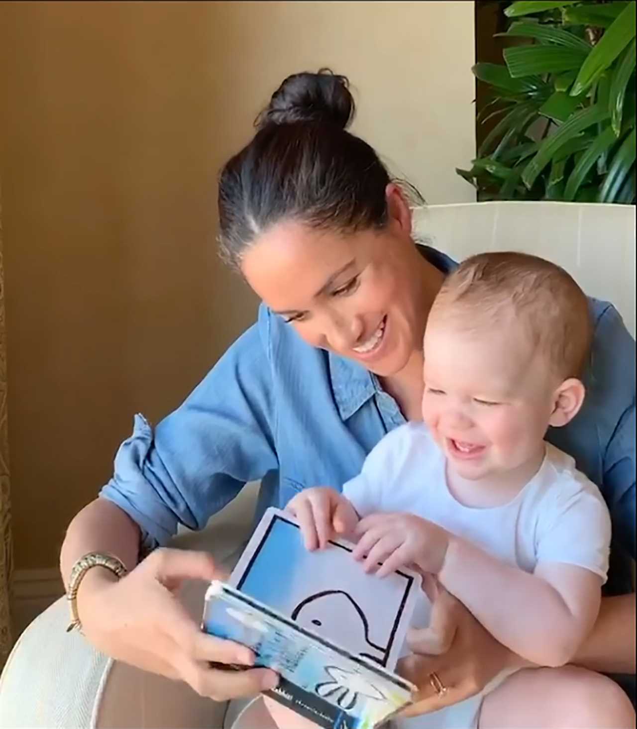 The Queen's message was posted next to this picture of Harry, Meghan and Archie as a baby