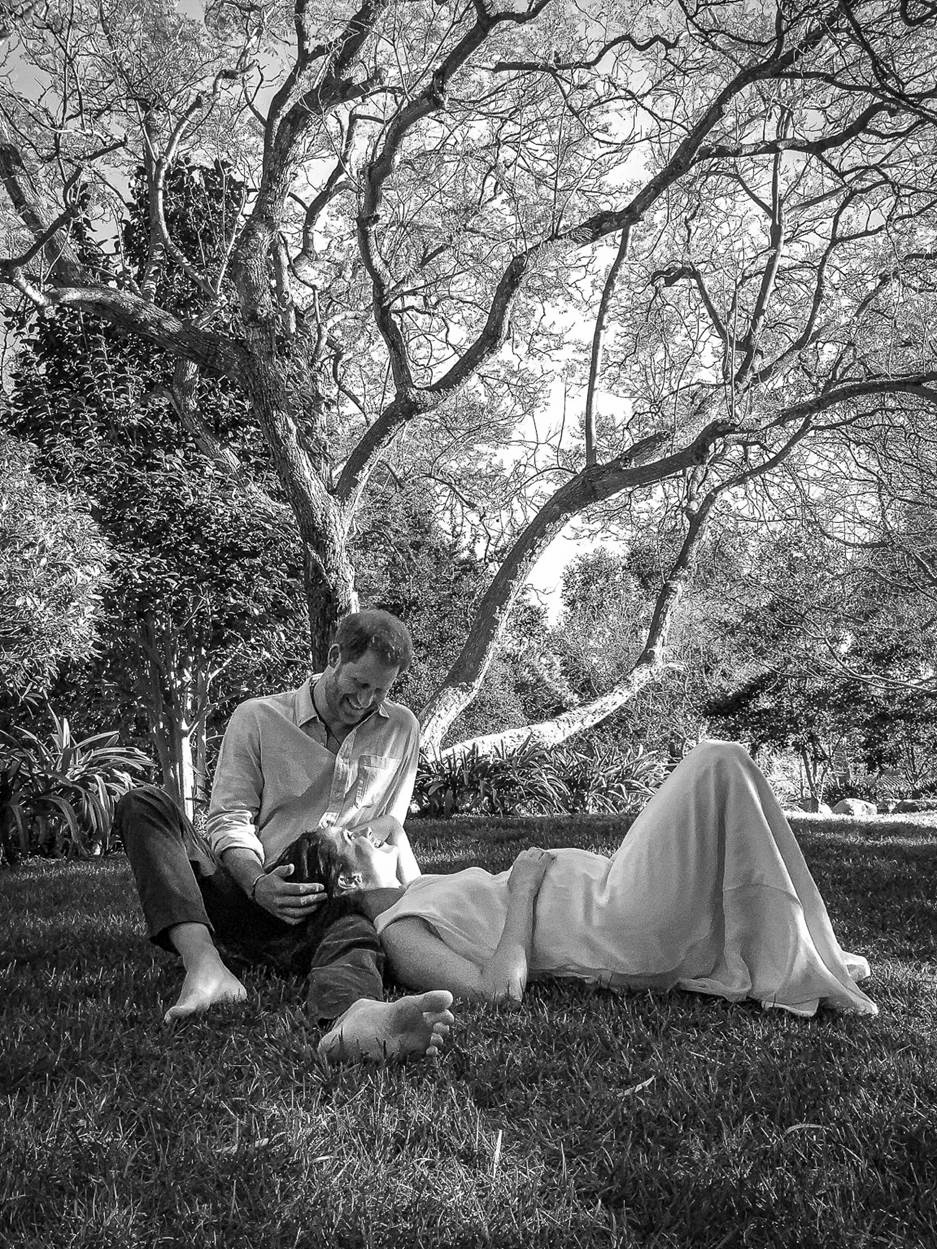 The couple shared a black and white picture of themselves under a tree in February to announce they were expecting another child