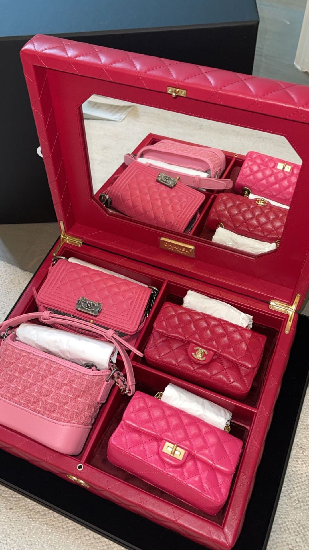 Travis Scott got her four pink and red Chanel bags