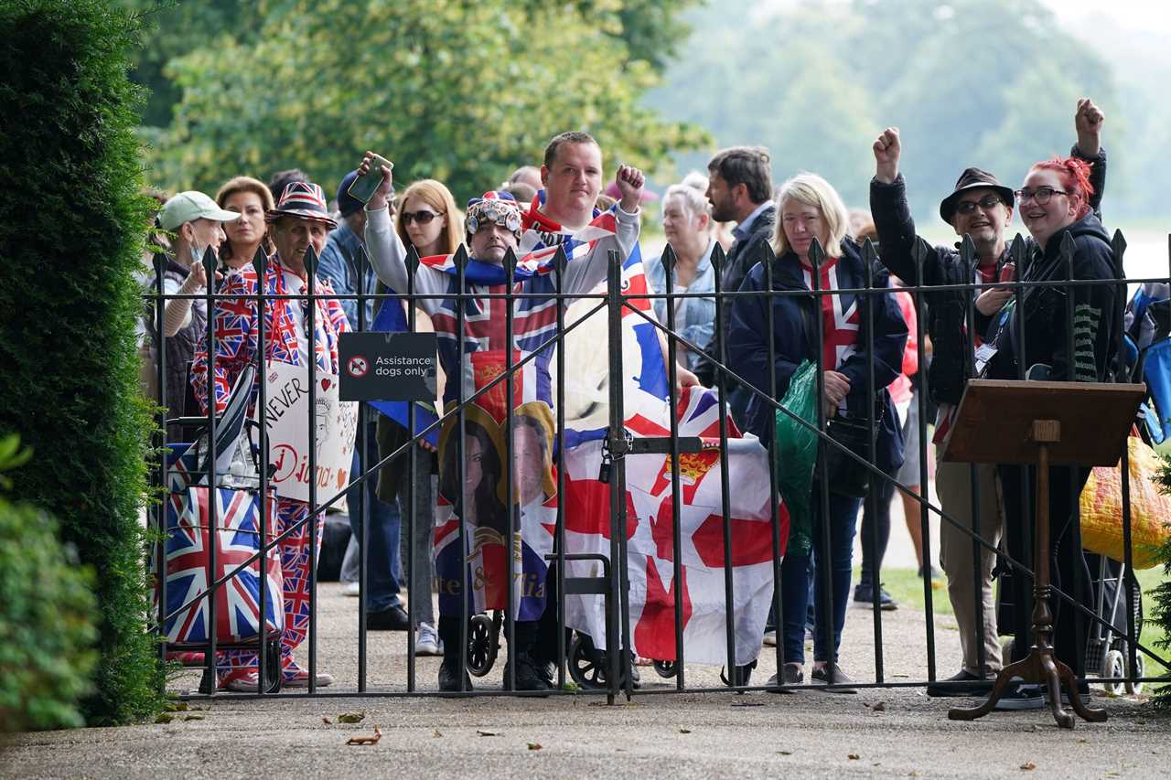 Members of the public wait to be let in to view the statue of Diana, Princess of Wales, in the Sunken Garden at Kensington Palace this morning