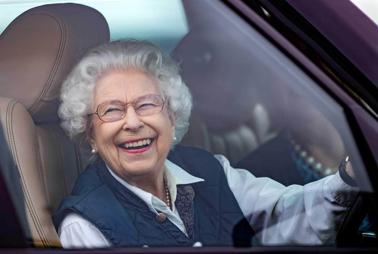 The Queen grinned as she arrived at the Windsor Horse Show in a Range Rover yesterday