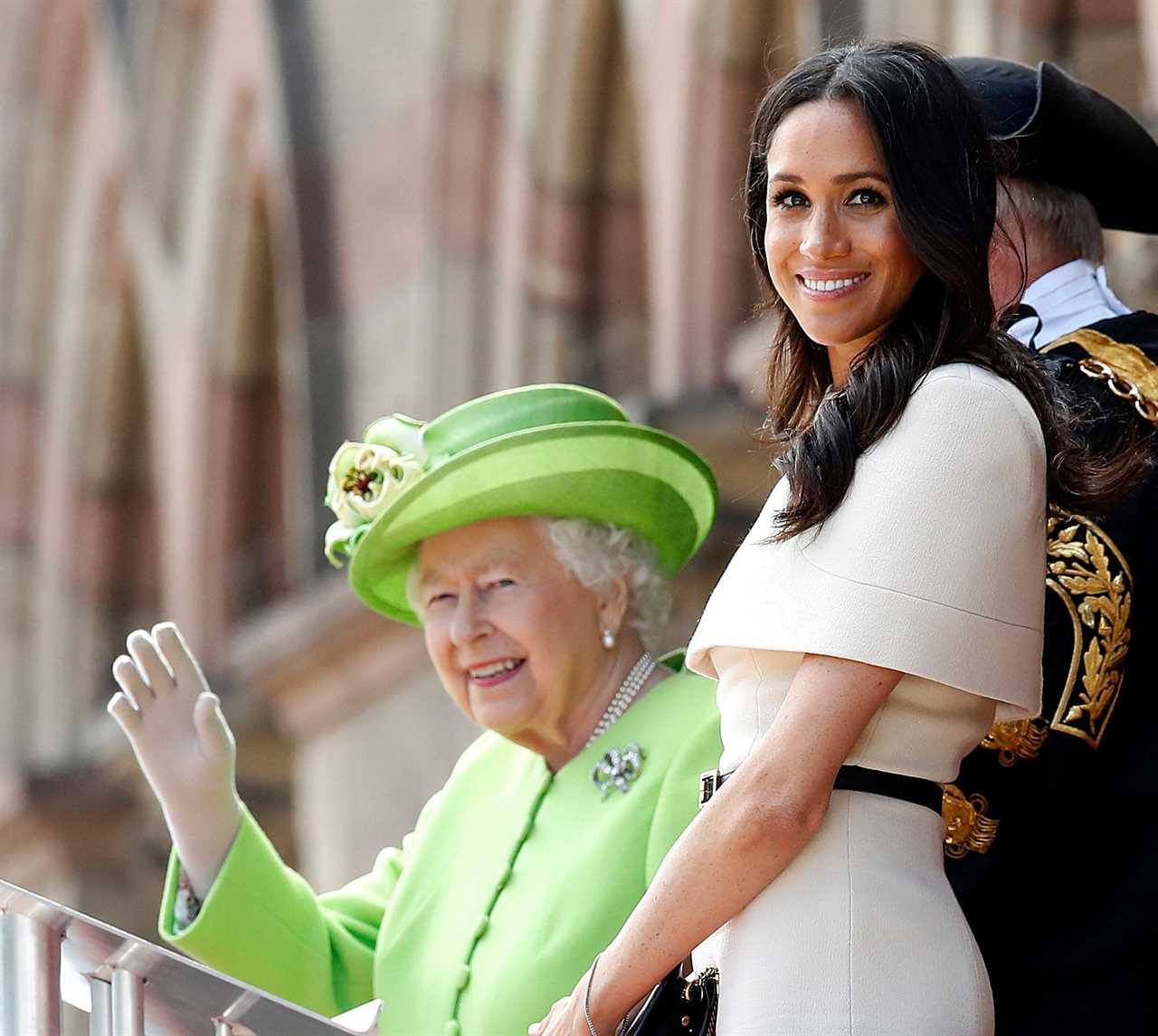 One of the pictures shows the Queen and Meghan in Chester in 2018