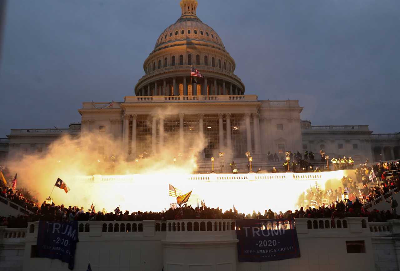 An explosion is seen after cops set off a police munition outside the Capitol