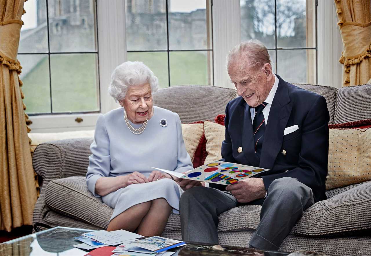 The Queen and Prince Philip open cards from their great-grandchildren 