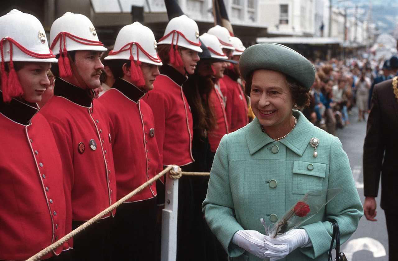 The Queen, 55, smiles during an inspection as she tours New Zealand on October 01, 1981