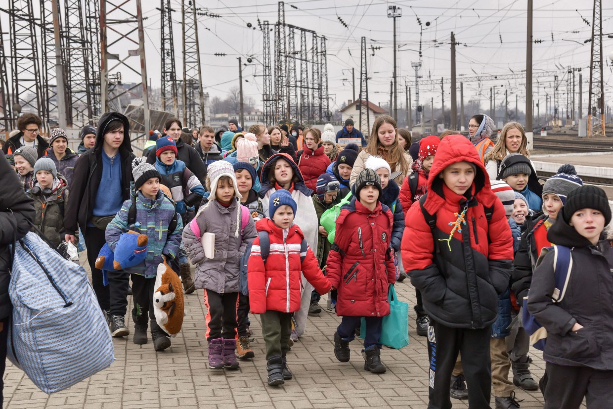 Evacuated children from an orphanage at the train station in Lviv, western Ukraine