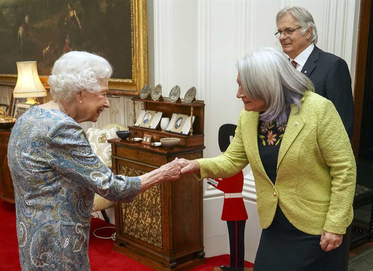 Queen beams during medal ceremony after being ordered to ‘pace herself’ following Covid scare