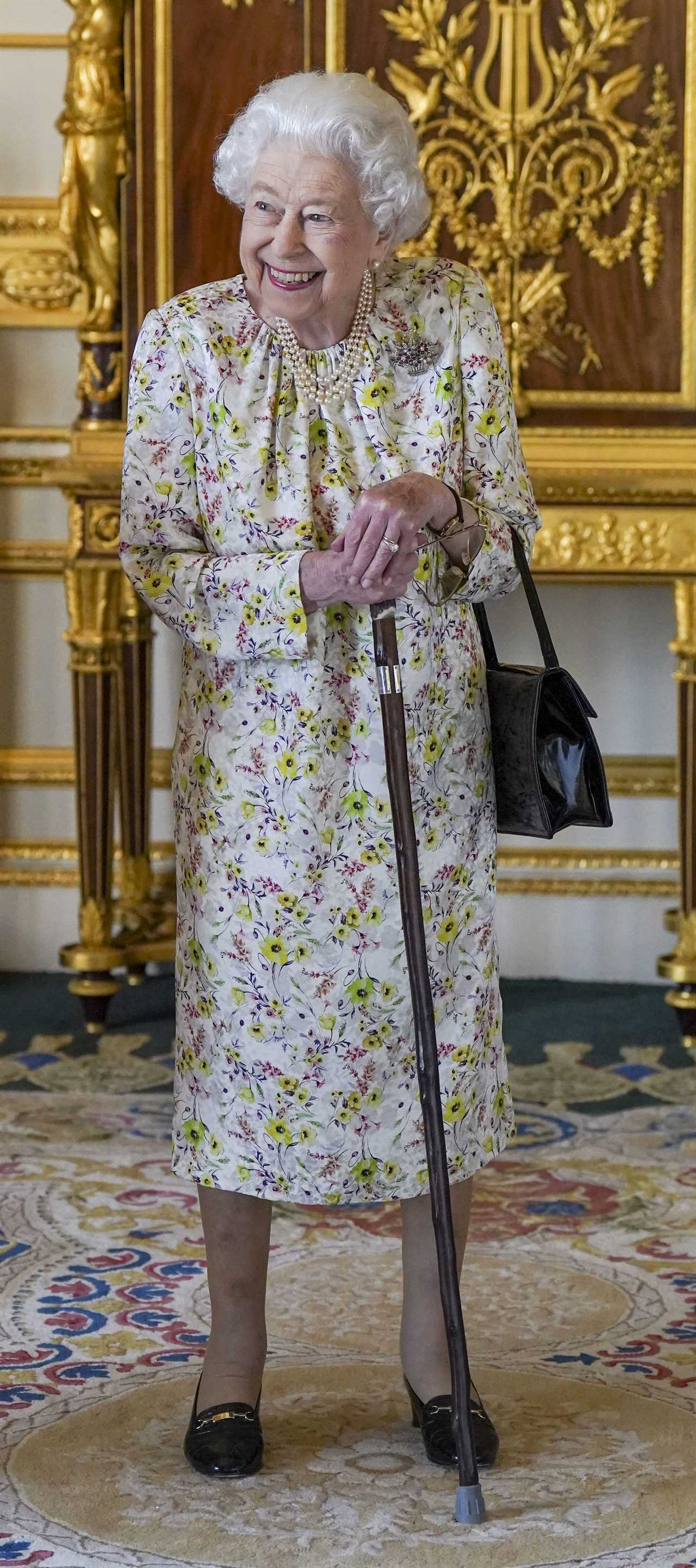 Her Majesty was pictured using a walking stick at Windsor Castle, Berks, on Wednesday