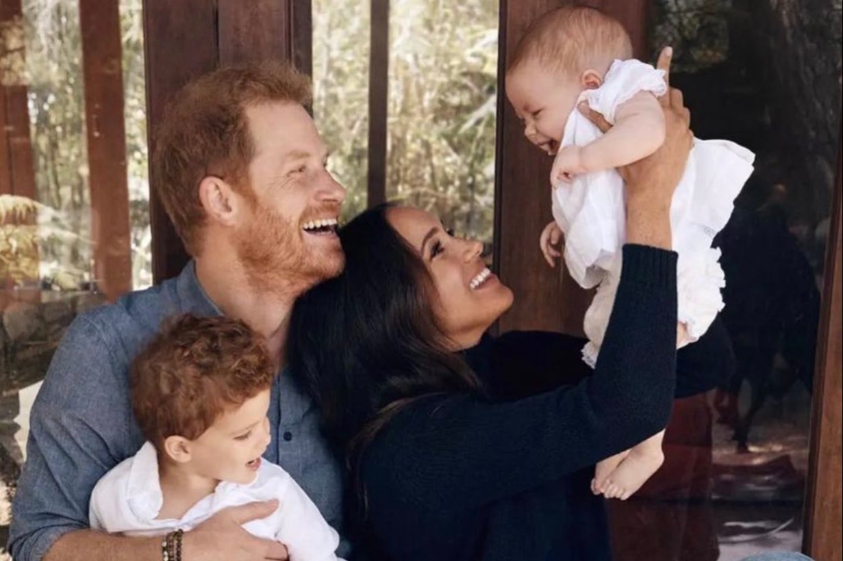 Meghan Markle grins as she plays with babies in unseen pictures – after admitting she misses Archie and Lilibet