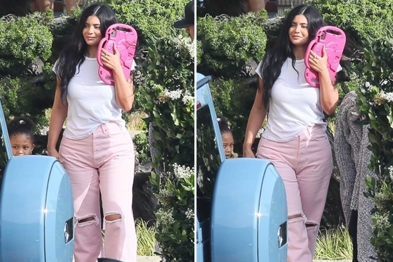 Kylie Jenner shows off her post-baby curves in a pink latex thong bodysuit to promote new makeup line with BFF Stassi