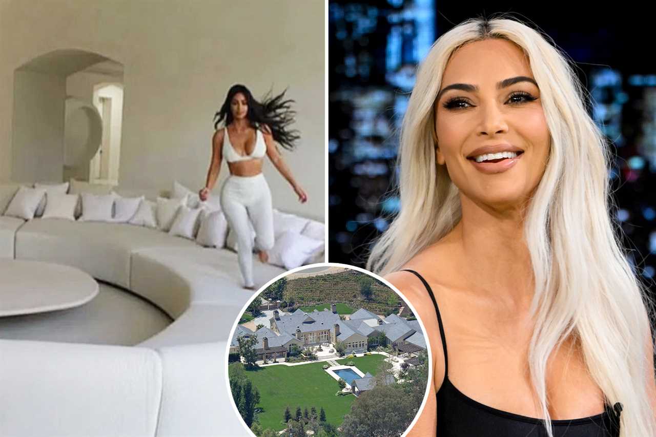 Kim Kardashian has near wardrobe malfunction as she desperately tries to keep her boobs from spilling out of minidress