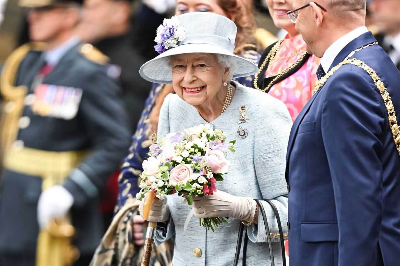 Queen, 96, beams in blue as she steps out with Prince Charles for military parade at Holyroodhouse