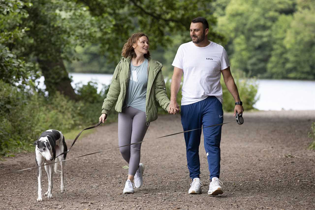 Chanelle Hayes flashes her sparkling engagement ring as she kisses fiancé Dan Bingham on dog walk