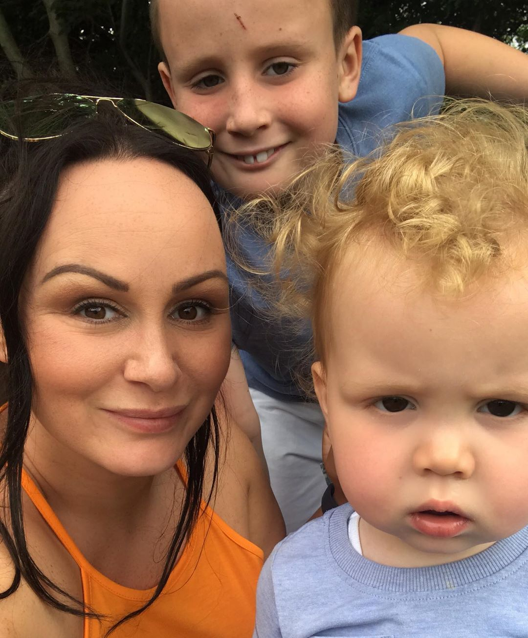 Chanelle Hayes flashes her sparkling engagement ring as she kisses fiancé Dan Bingham on dog walk