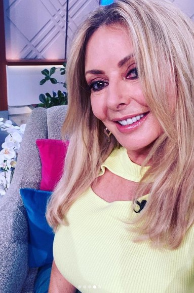 Carol Vorderman looks incredible in skintight leather skirt as she poses backstage at ITV