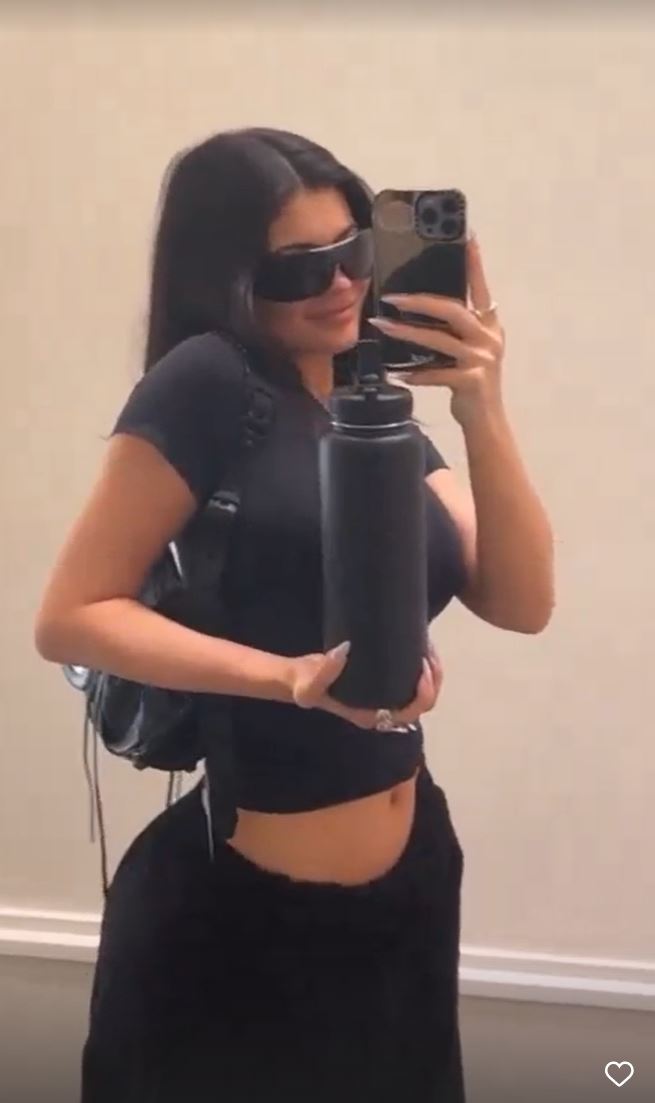 Kylie Jenner shows off her tiny waist in just a crop top just months after giving birth to baby son