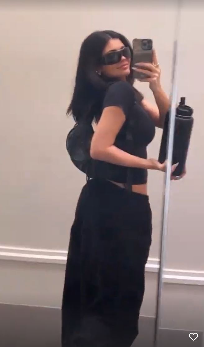 Kylie Jenner shows off her tiny waist in just a crop top just months after giving birth to baby son