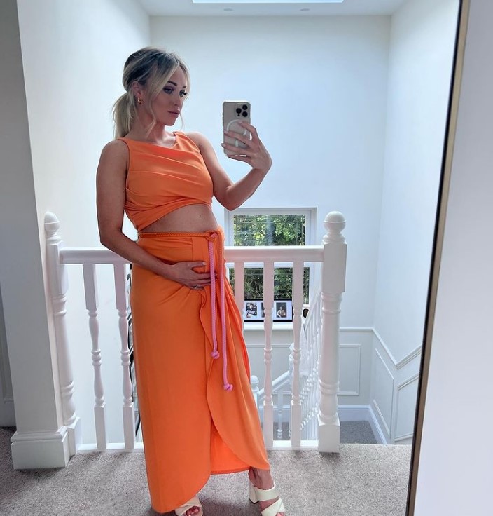 Jorgie Porter shows off baby bump in bright crop top as she celebrates engagement