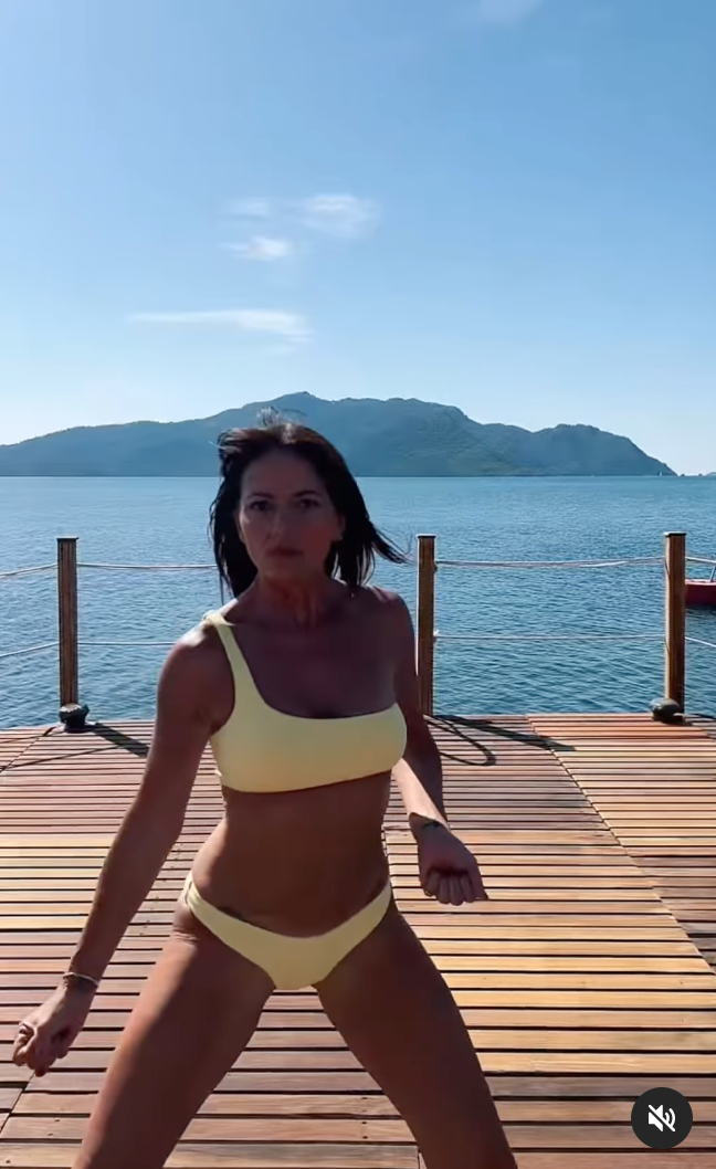 Davina McCall, 54, twerks in a yellow bikini as she reveals incredible figure on holiday