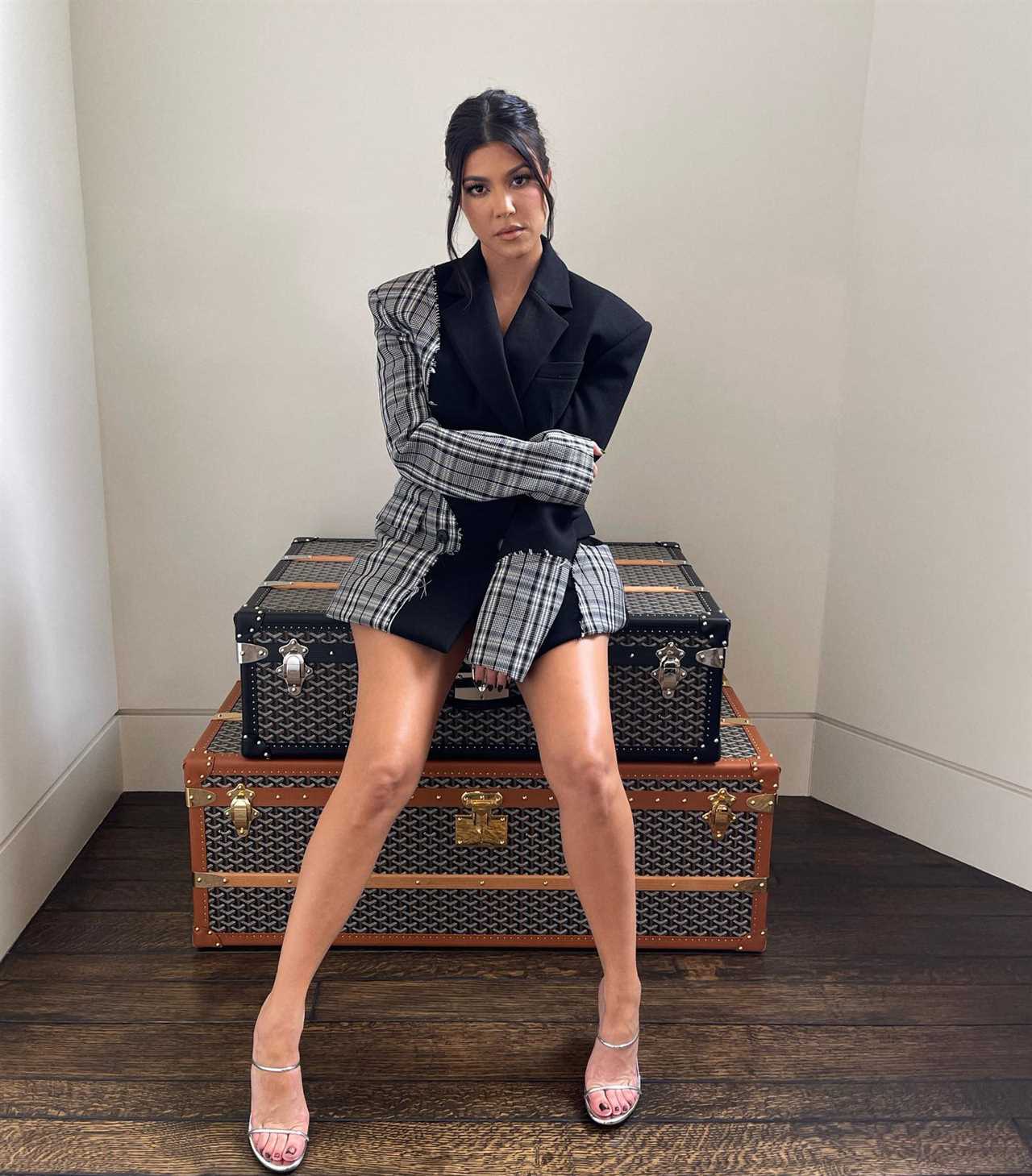 Kourtney Kardashian gives rare glimpse into her office with vintage photos & rack of designer clothes at her $9M mansion