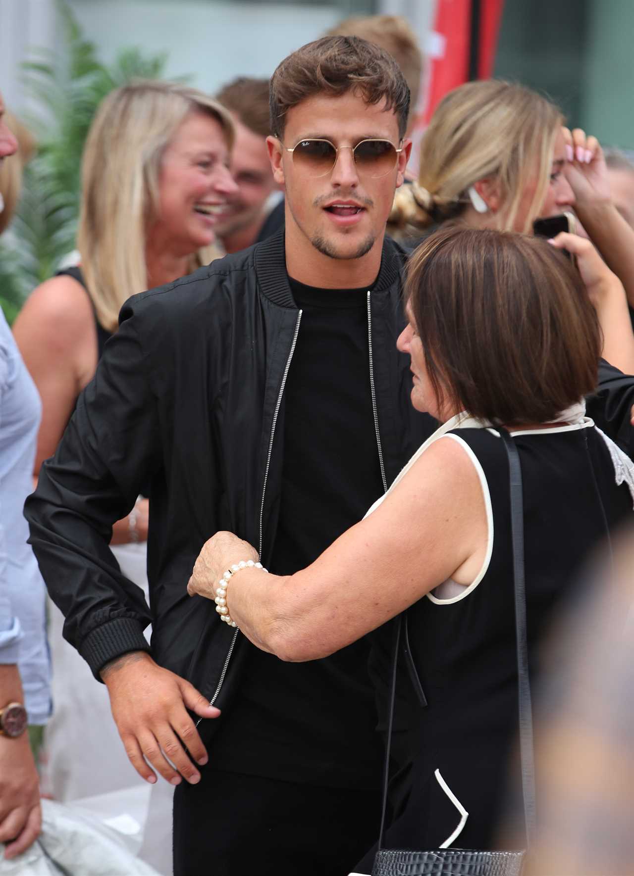 Love Island finalists look ecstatic as they get mobbed at the airport as they finally arrive home