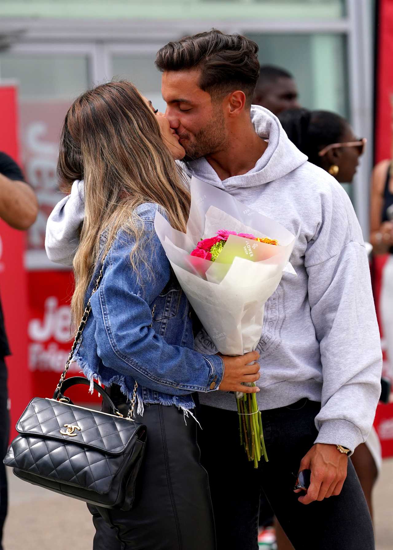 Love Island finalists look ecstatic as they get mobbed at the airport as they finally arrive home