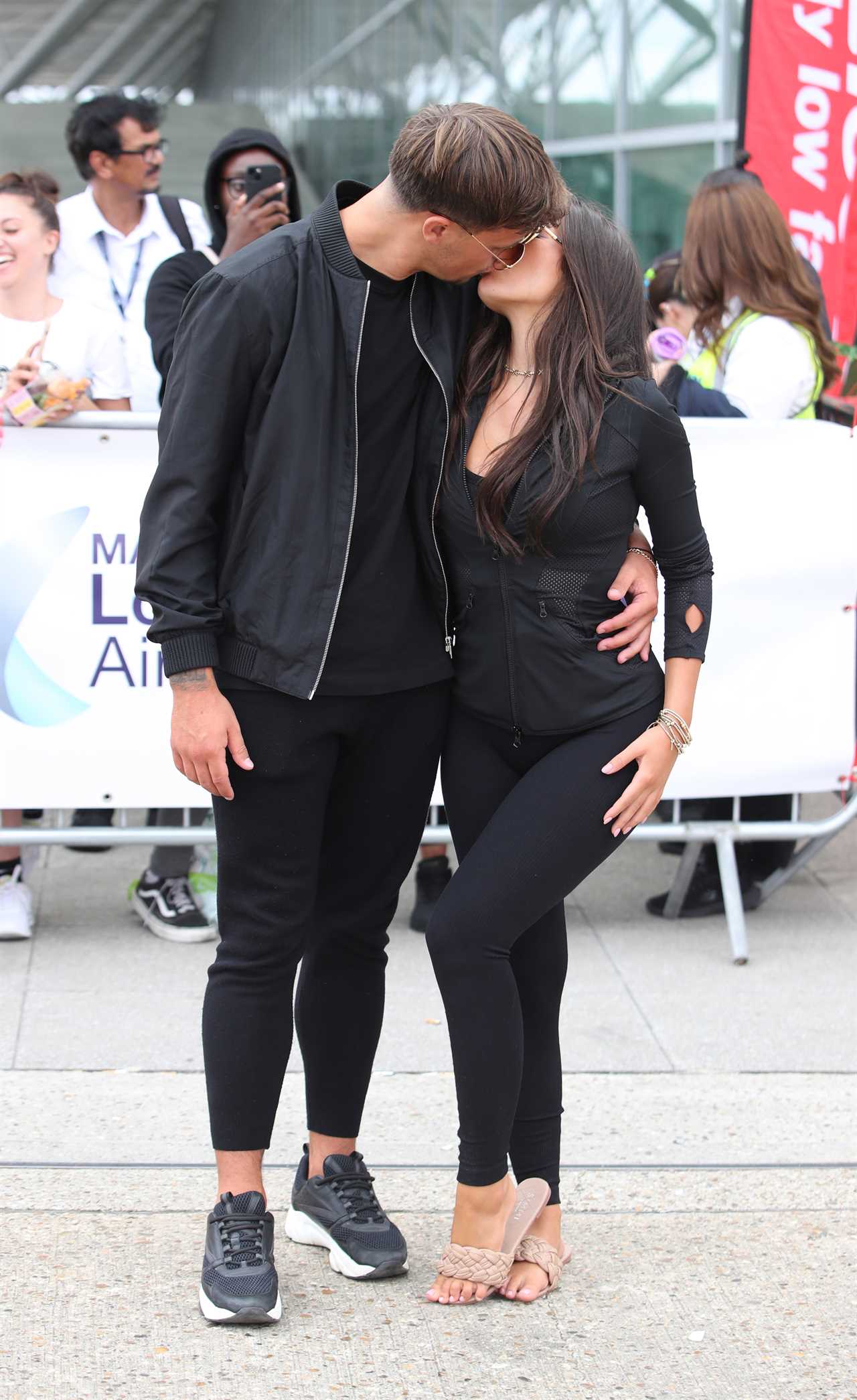 Love Island finalists look ecstatic as they get mobbed at the airport as they finally arrive home