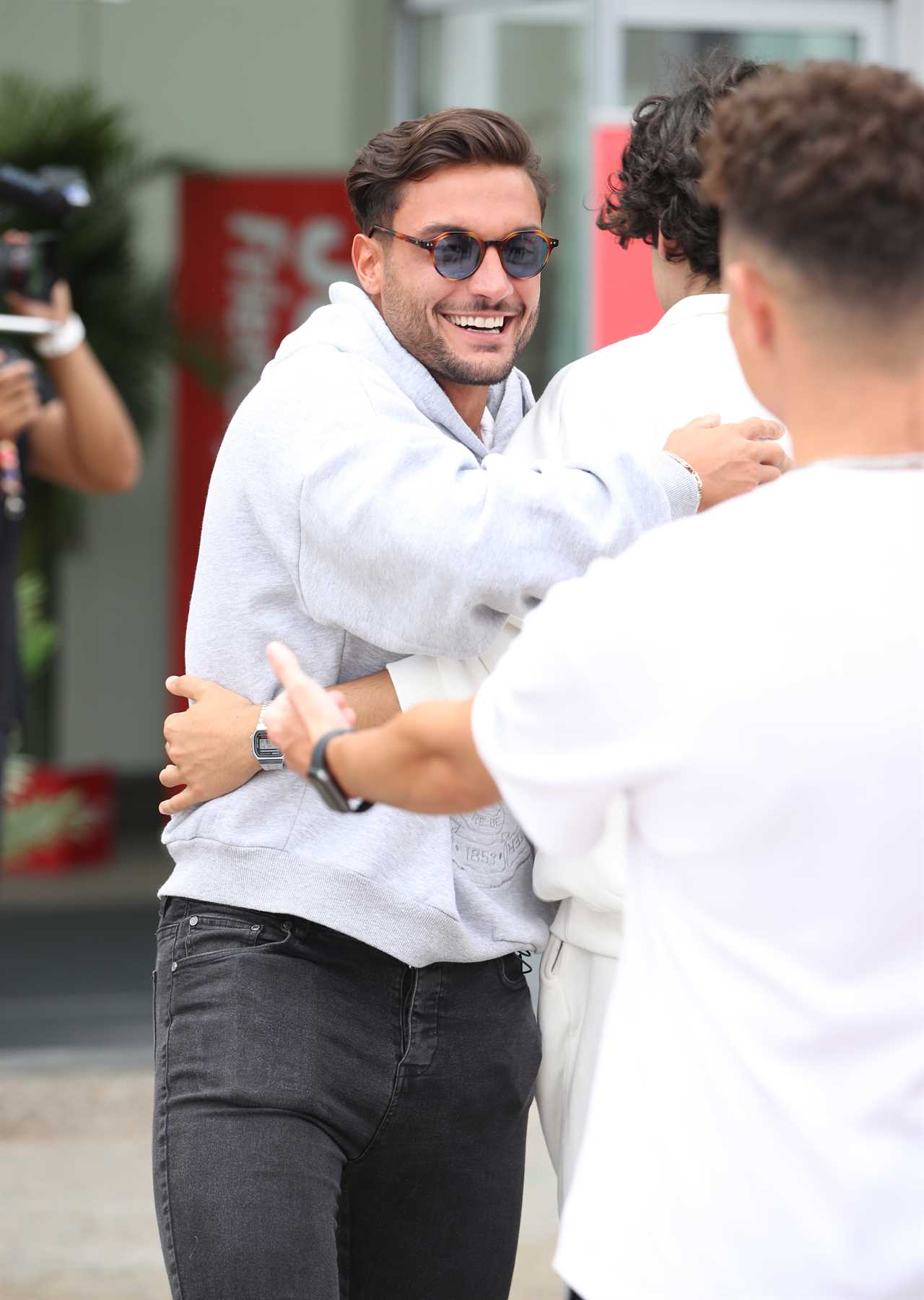 Love Island finalists look ecstatic as they get mobbed at the airport as they finally arrive home