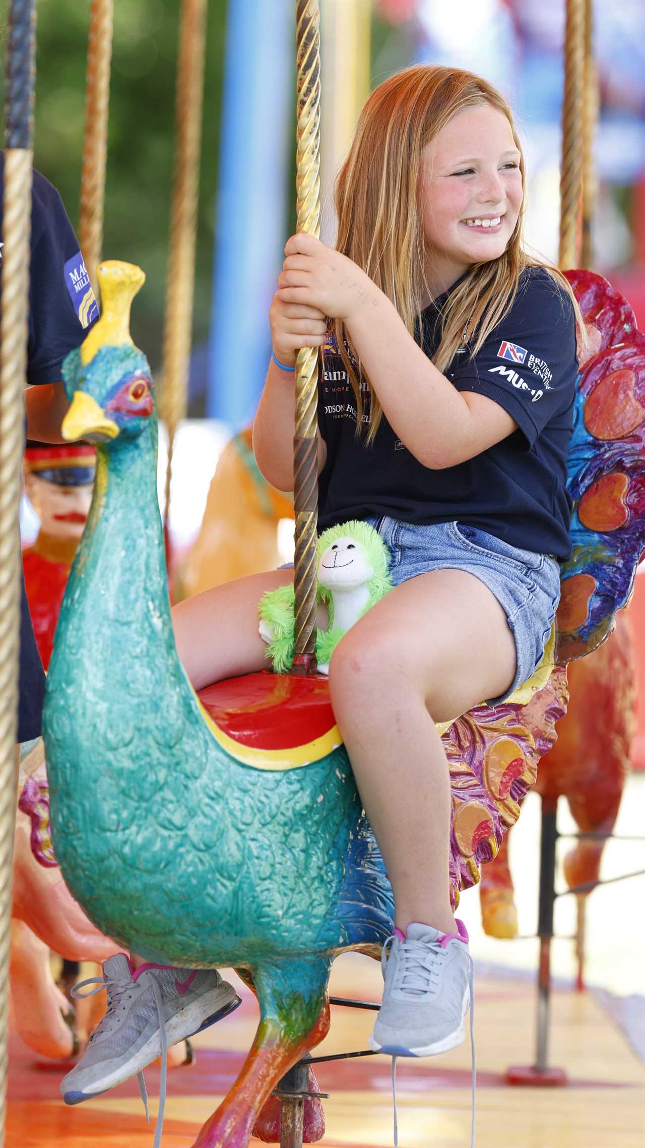 Zara Tindall’s daughter Mia looks like she’s following in her equestrian footsteps as she jumps on a carousel