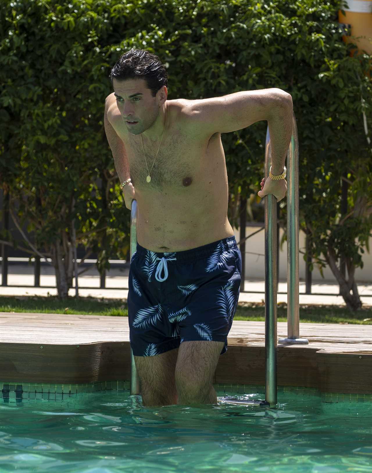 Shirtless James Argent shows off 14st weight loss in swimming trunks as he takes a dip in Marbella