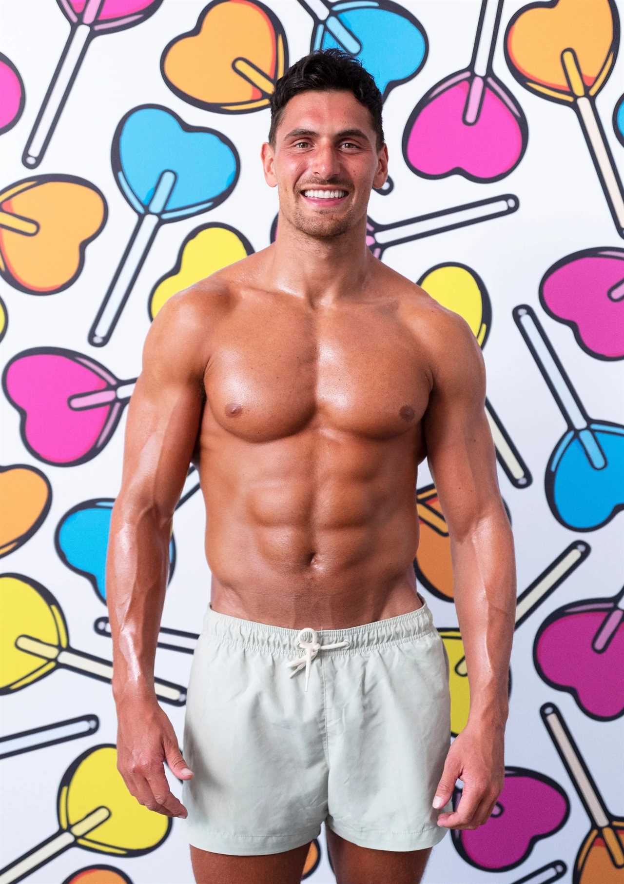 Love Island star returns to his normal day job and poses in the office after failing to find love in the villa