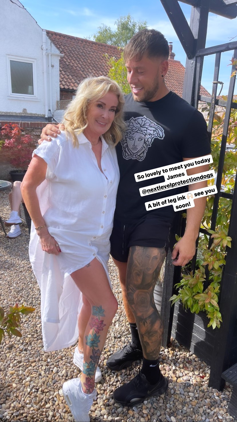 Coronation Street legend Bev Callard flashes her toned tattooed leg as she poses with a heavily inked pal