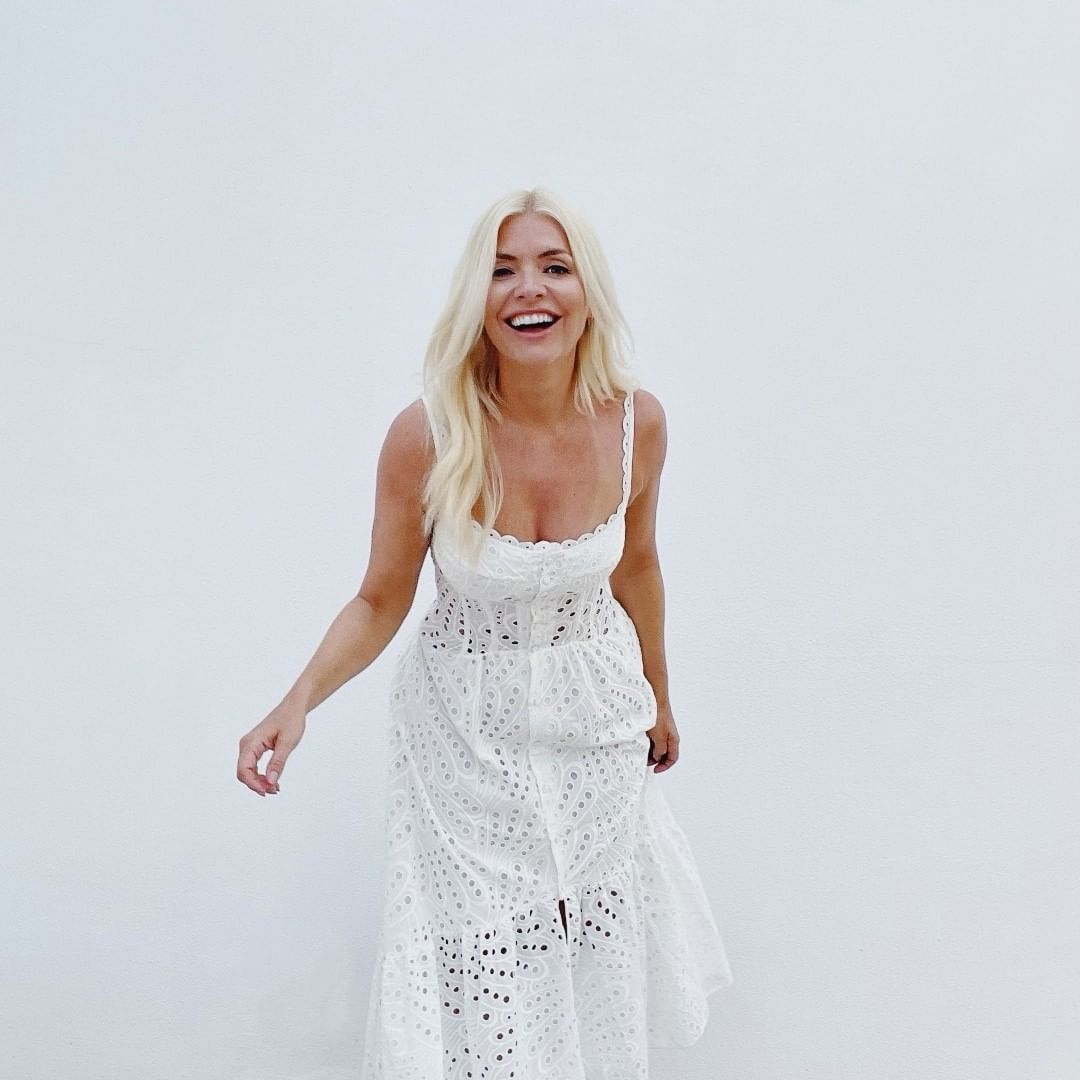 Holly Willoughby looks stunning as she shows off her new hair in a white dress on holiday