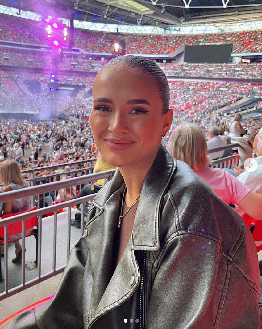 Molly-Mae Hague kisses Tommy Fury on romantic date night to see Coldplay at Wembley