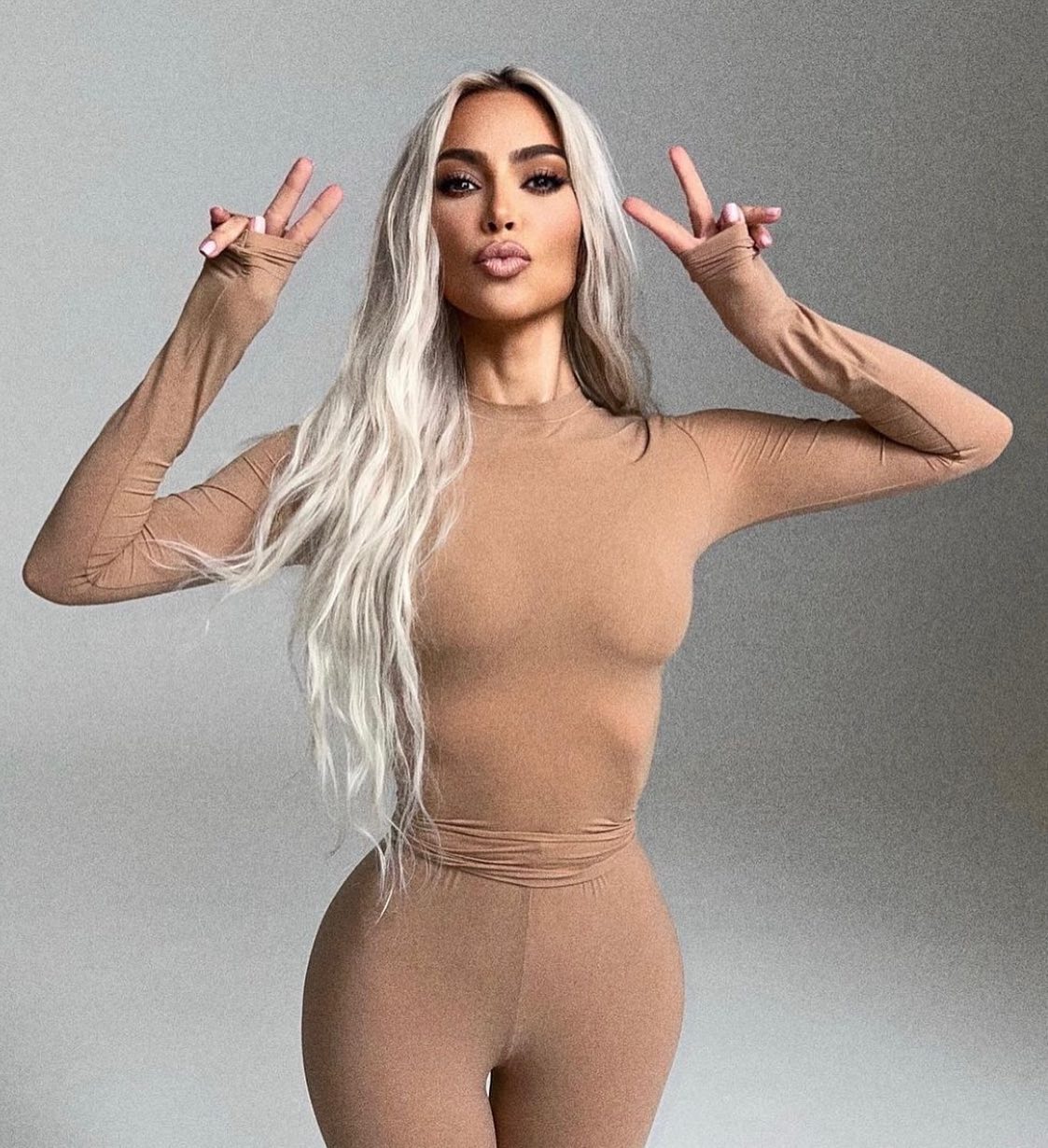 Kardashian fans slam Kim as ‘tasteless’ for posing with a mountain of designer bags after outrage for ‘flaunting wealth’