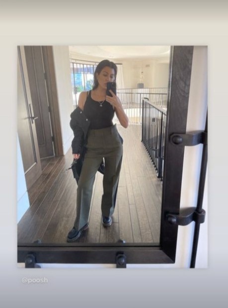 Kourtney Kardashian hides her stomach with baggy pants as fans convinced she’s pregnant with Travis Barker’s baby