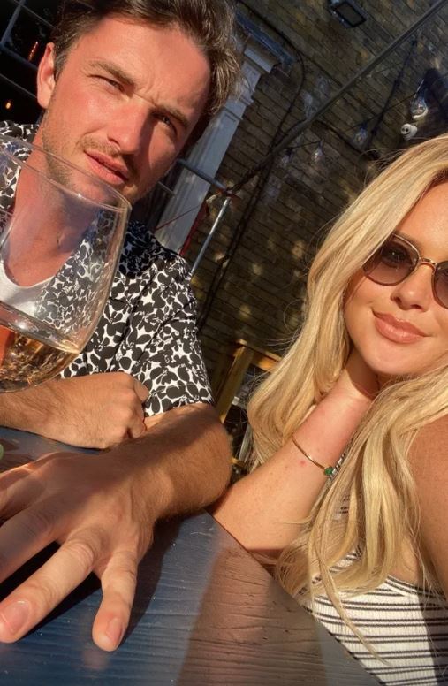 Emily Atack drinks cocktails in plunging dress after hitting the beach on holiday