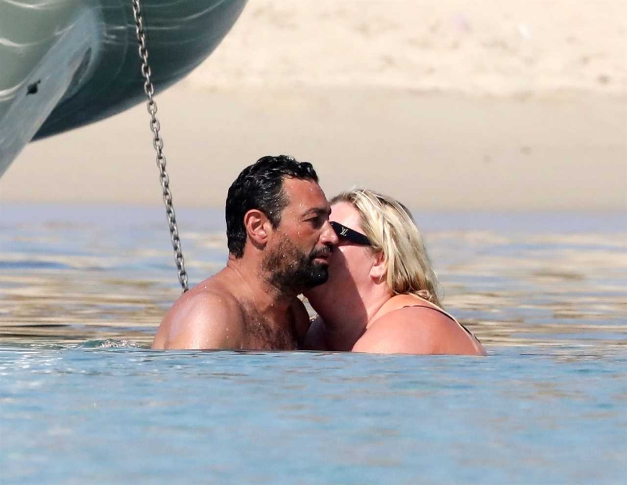 Gemma Collins looks more loved up than ever with fiancé Rami as they kiss in the sea in Greece