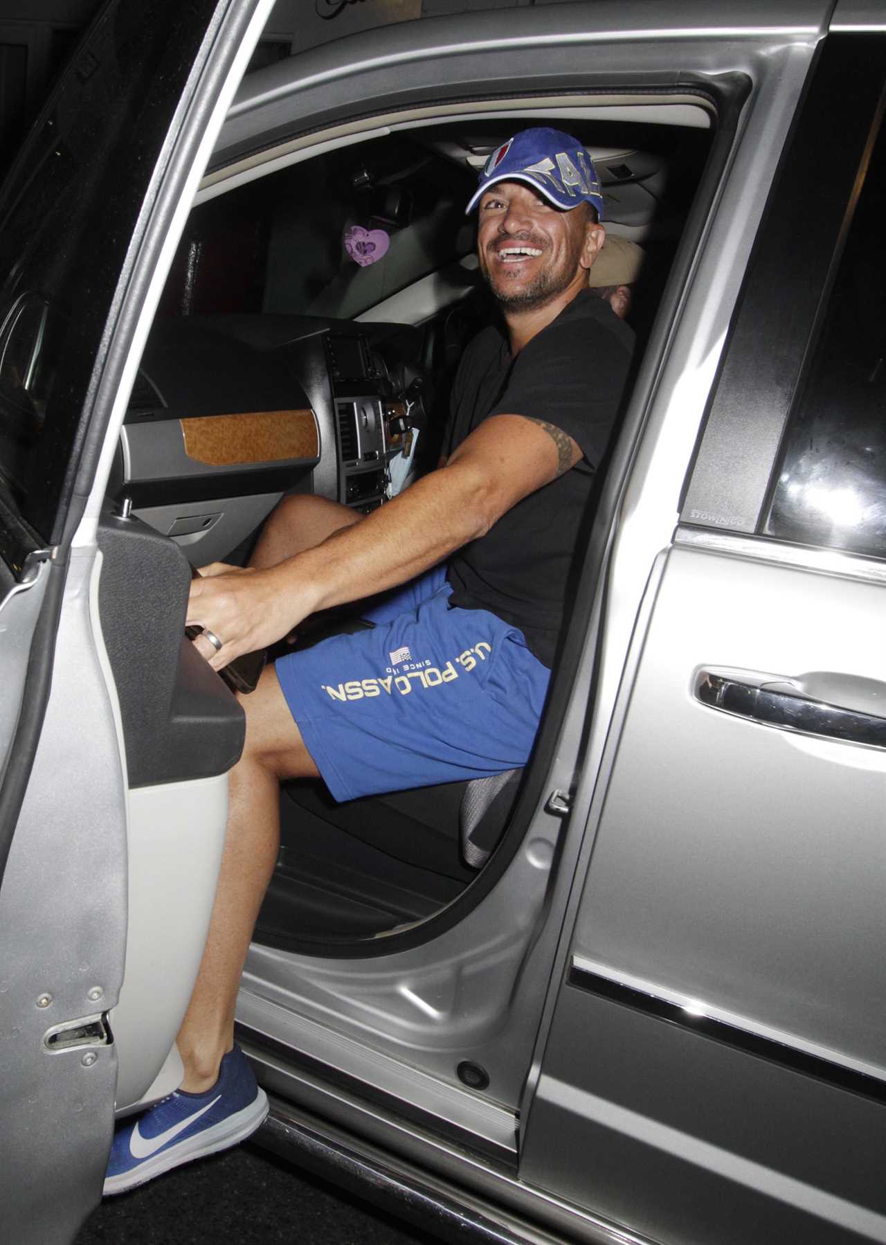 Peter Andre is all smiles as he leaves Grease musical in a T-shirt and shorts