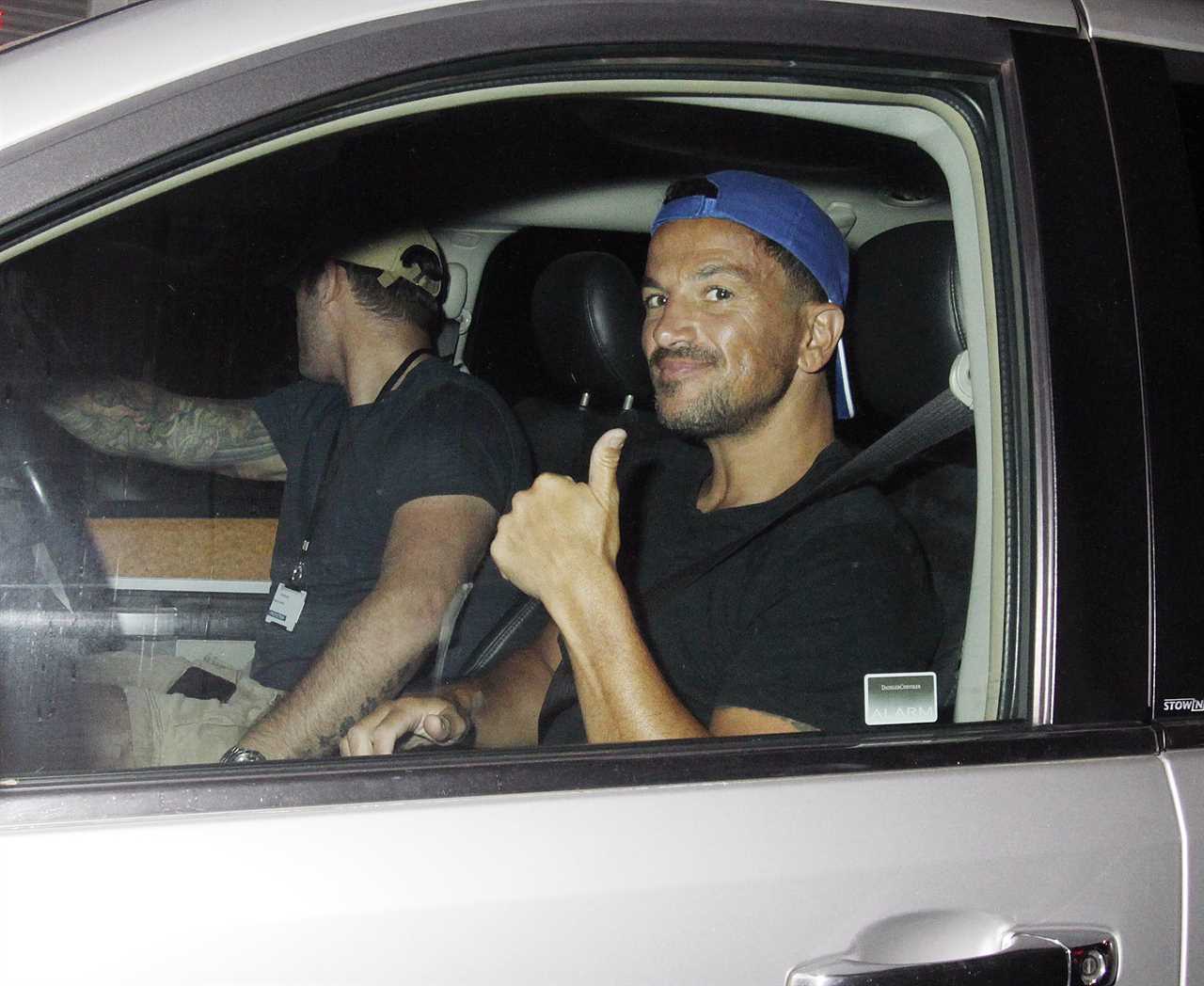 Peter Andre is all smiles as he leaves Grease musical in a T-shirt and shorts