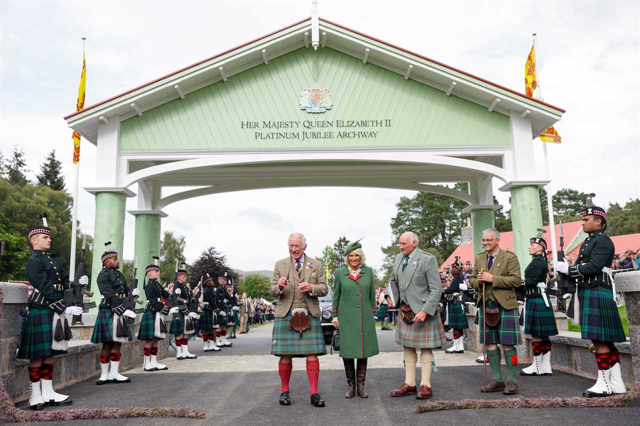 Prince Charles enjoys Highland games as he stands in for the Queen, 96, at one of her favourite events