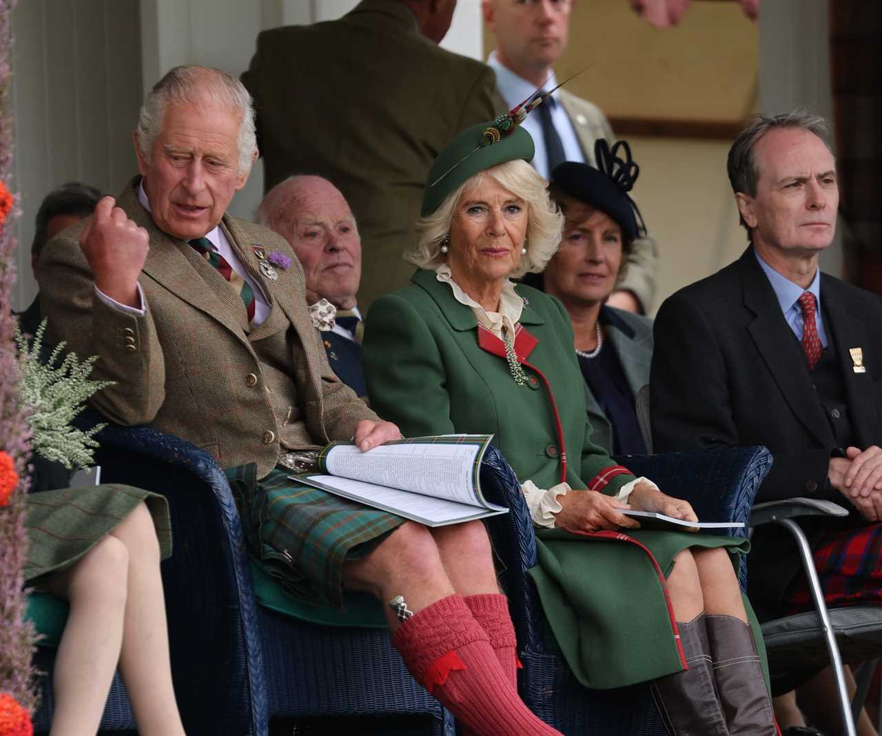 Prince Charles enjoys Highland games as he stands in for the Queen, 96, at one of her favourite events