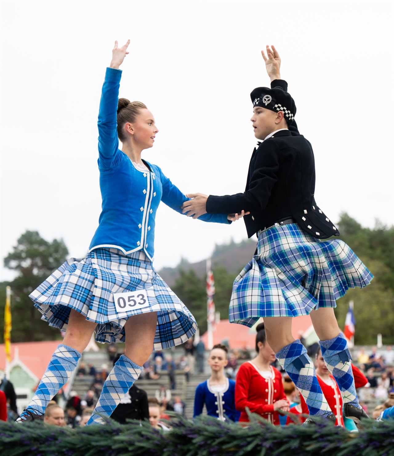 Prince Charles enjoys Highland games as he stands in for the Queen, 96, at one of her favourite events