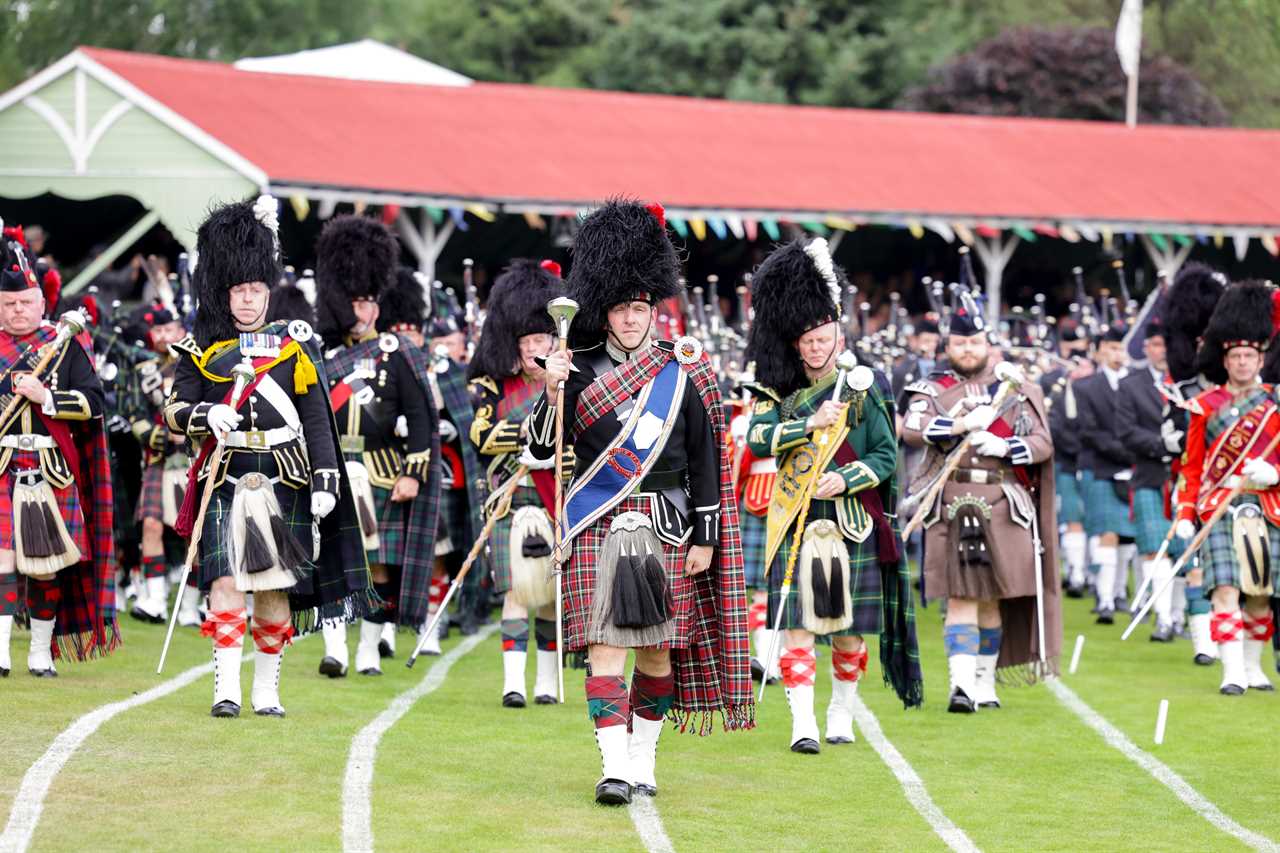 Prince Charles enjoys Highland games as he stands in for the Queen, 96, at one of her favourite events