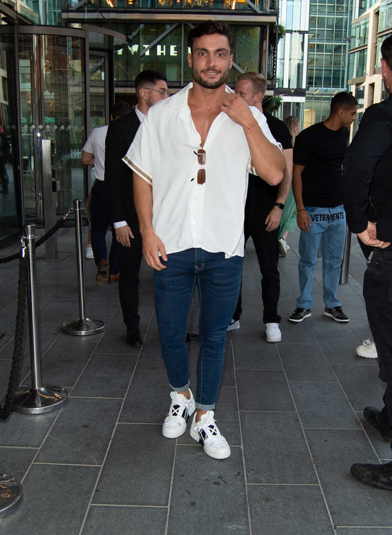 Love Island champ Davide Sanclimenti celebrates with shots after signing six-figure fashion deal